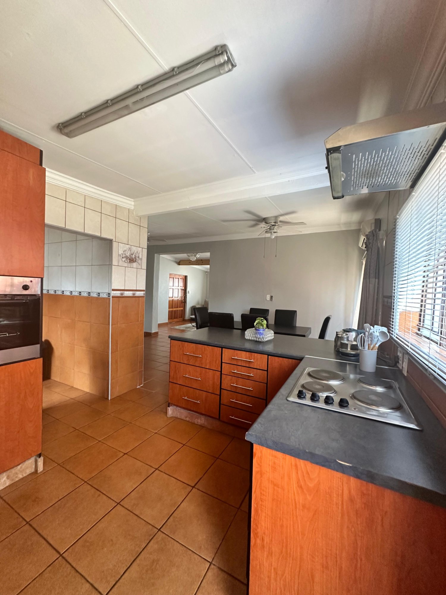Fully equipped shared kitchen with oven, hob, and ample counter space